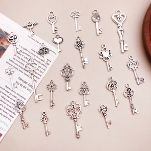Macro view of vintage silver alloy key pendants for DIY jewelry and handmade accessories