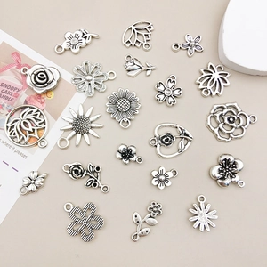 Collection of twenty antique silver alloy flower charms for DIY jewelry and earrings