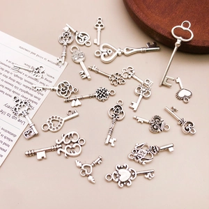 Collection of vintage silver alloy key pendants for DIY jewelry and crafting