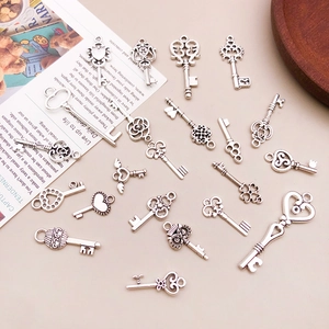 Detailed collection of vintage silver alloy heart and key charms for DIY jewelry making