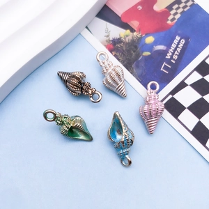 Macro shot of colorful starfish and seashell charms for DIY jewelry and accessories