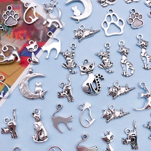 Antique silver cat pendants and hollow paw print alloy charms for DIY jewelry making