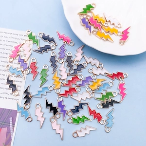 Macro detail of colorful enamel lightning bolt charms for DIY jewelry making and crafts