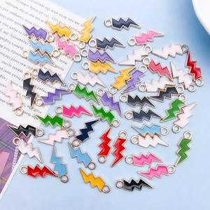 Flat lay of colorful lightning bolt enamel charms for DIY jewelry making accessories