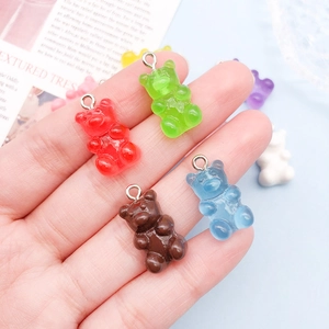 Detailed view of colorful translucent resin gummy bear pendants for DIY jewelry making
