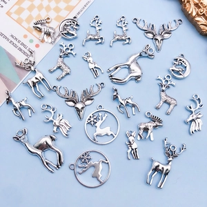 Set of 11 vintage silver deer charms in various elk and reindeer shapes for DIY jewelry