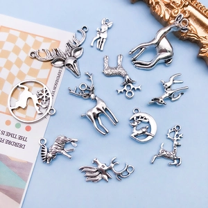 Macro shot of assorted vintage silver deer charms for handmade jewelry and DIY crafts