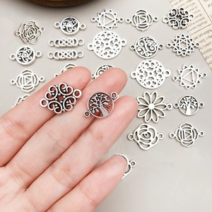 Set of vintage silver alloy hollow flower charms and mandala pendants for DIY jewelry making