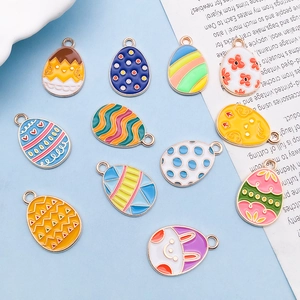Detailed set of colorful enamel Easter egg pendants with cute bunny and chick patterns