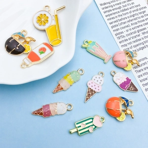 Macro view of colorful summer fruit drinks and ice cream alloy charms for DIY jewelry making