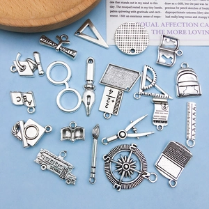 Retro silver graduation charms set featuring school buses and caps for DIY jewelry