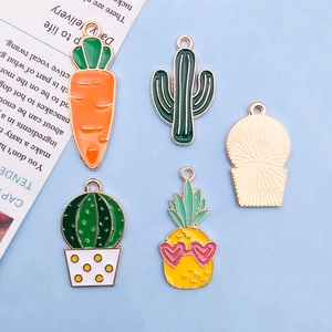 Detail of colorful alloy enamel cactus, carrot, and pineapple charms for DIY jewelry