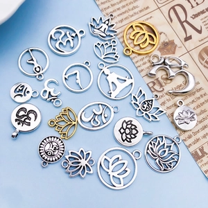 Assorted yoga lotus Om pendants in antique silver and gold for DIY jewelry making