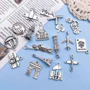 Retro antique silver travel pendants featuring Eiffel Tower and world landmarks charms