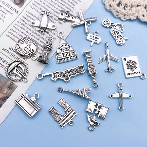 Vintage silver alloy travel charms set featuring Eiffel Tower, passport and plane pendants