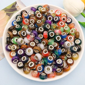 Close-up of vibrant gradient cat eye resin beads with 5mm large holes for DIY jewelry