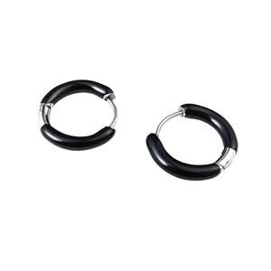 Detail view of round geometric earrings with black enamel inlay and silver finish