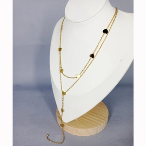Gold double-layered heart pendant necklace for women on minimalist display stand
