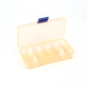 Detail view of transparent yellow 10-compartment plastic organizer with blue latch closure