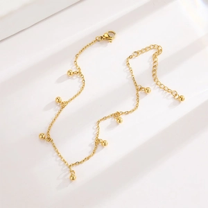 Minimalistisches 18K Gold Titanstahl Fußkettchen mit polierten Perlen und Verlängerungskette
