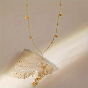 Elegante collana a Y placcata in oro 18K con perline e nappa lunga pendente da donna