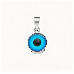 Macro shot of evil eye blue glass pendant with silver metal frame on white background