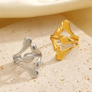 Detail of 18K gold and silver plated irregular irregular hollow line rings on stone