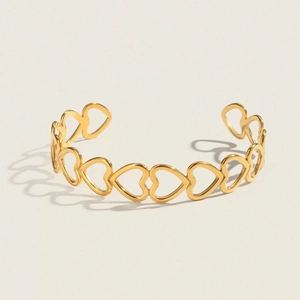 Elegant gold hollow heart-shaped stainless steel open cuff bracelet for women