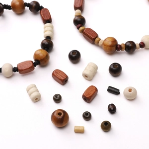 Detailed arrangement of natural wood beads in various shapes and earthy tones for DIY jewelry