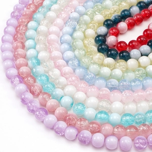 Macro detail of colorful cracked glass beads for DIY jewelry making neatly arranged