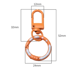 Orangefarbene Donut-Federringschließe mit bunten Punkten für DIY-Taschen und Schlüsselanhänger