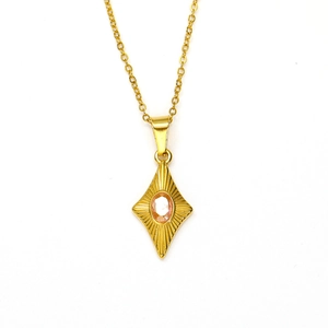 Detail view of a gold-plated necklace with a pink oval gem in a rhombus pendant