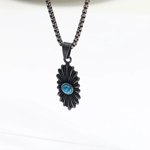 Vintage oxidized silver necklace with sunburst turquoise pendant on a box chain