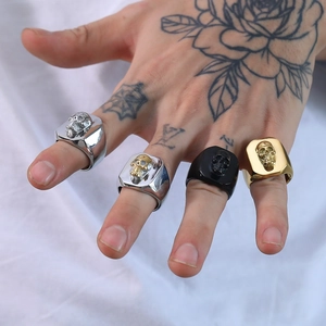 Men's punk skull rings set in silver, gold, and black stainless steel finishes