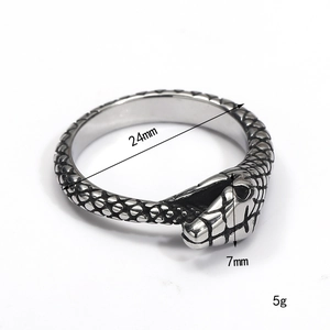 Detailed view of snake-shaped titanium steel ring showing scale texture and 7mm head width