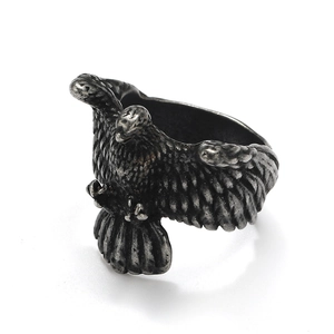 Macro shot of a retro eagle wing ring in oxidized silver with detailed feather textures