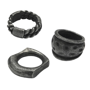 Close-up of vintage punk style distressed titanium steel geometric rings set