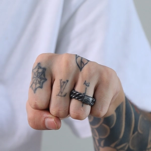 Vintage industrial style braided stainless steel ring with a weathered grey finish
