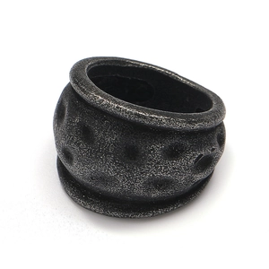 Macro view of vintage industrial steel ring with oxidized meteorite surface texture