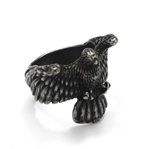 Macro shot of punk eagle ring showing detailed feathers in antique titanium steel
