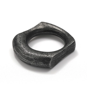 Macro shot of industrial vintage titanium steel ring with aged textured finish