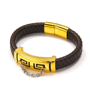Detail of braided leather bracelet with golden Greek meander plate and magnetic clasp
