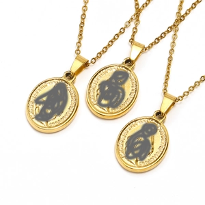 Three gold oval portrait necklaces with embossed text on cross chain and white background