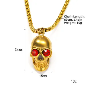 Gouden punk schedelhanger met rode strass-ogen aan bijpassende gouden kralenketting