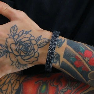 Men's Viking style black silicone cuff bracelet with embossed Nordic rune symbols