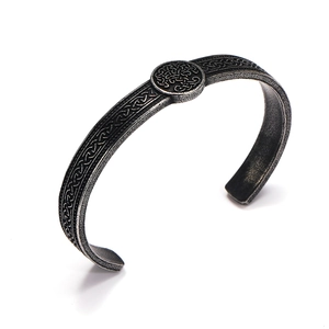 Detail of vintage Viking steel cuff featuring Tree of Life and Celtic knotwork pattern