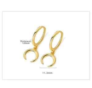 Detail showing S925 sterling silver stamp on golden crescent moon huggie earrings