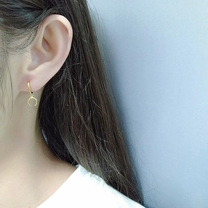 Minimalist S925 sterling silver crescent moon hoop earring in gold finish on model