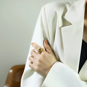 Close-up of polished 18k gold-plated titanium steel star ring on a model's finger