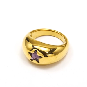 Macro shot of 18k gold plated dome ring with a purple star-shaped zircon stone